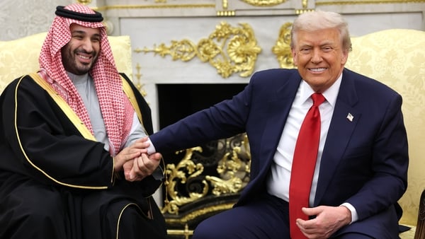 Donald Trump takes the hand of Crown Prince Mohammed bin Salman of Saudi Arabia