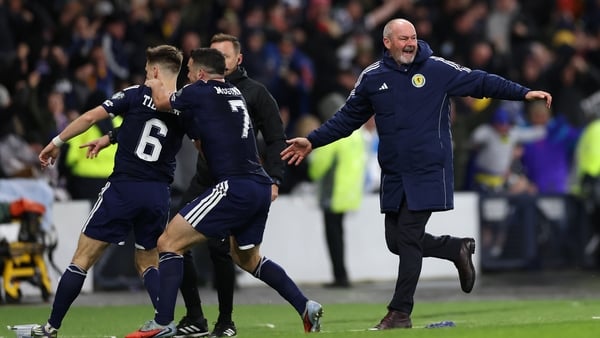 GLASGOW, SCOTLAND - NOVEMBER 18: Kieran Tierney of Scotland celebrates scoring his team's third goal with Steve Clarke, Head Coach of Scotland, and teammates during the FIFA World Cup 2026 qualifier match between Scotland and Denmark at Hampden Park on No