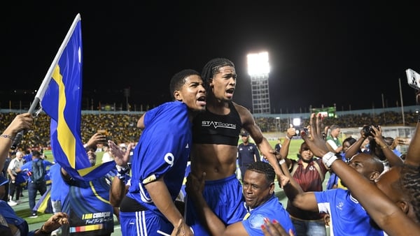 Curaçao players and fans celebrate World Cup 2026 qualification after a 0-0 draw with Jamaica