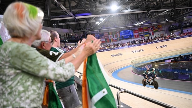 1 September 2024; Katie George Dunlevy, left, and pilot Eve McCrystal of Ireland are cheered on by friends and family after winning silver in the women's 3000m individual pursuit final on day four of the Paris 2024 Paralympic Games at Vélodrome de Saint-Quentin-en-Yvelines in Paris, France. Photo by