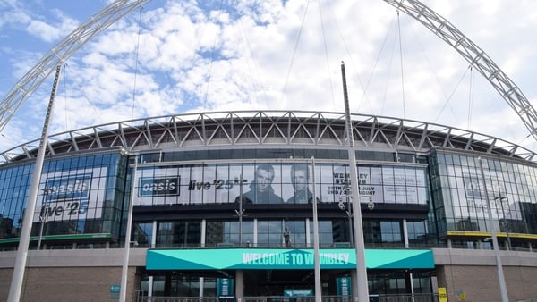 Screens at Wembley Stadium advertise gigs by Oasis in July and August 2025 at the famous stadium
