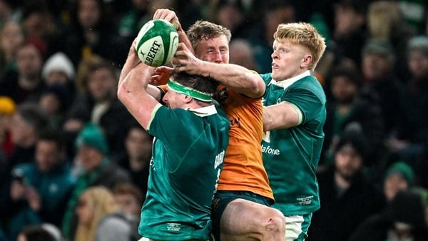 15 November 2025; Harry Potter of Australia in action against Ryan Baird, left, and Tommy O’Brien of Ireland during the Quilter Nations Series 2025 match between Ireland and Australia at the Aviva Stadium in Dublin. Photo by Ramsey Cardy/Sportsfile