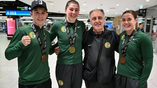 15 September 2025; Ireland head coach Zaur Antia with Ireland boxers, from left, Patsy Joyce with his bronze medal from the Men's 55kg, Aoife O'Rourke with her gold medal from the Women's 75kg and Grainne Walsh with her bronze medal from the Women's 65kg on their arrival at Dublin Airport following 