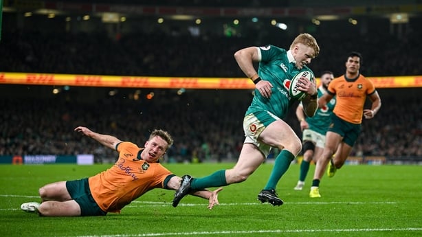 15 November 2025; Tommy O'Brien of Ireland evades the tackle of Harry Potter of Australia on his way to scoring a try, which was subsequently disallowed by the TMO, during the Quilter Nations Series 2025 match between Ireland and Australia at the Aviva Stadium in Dublin. Photo by Seb Daly/Sportsfile