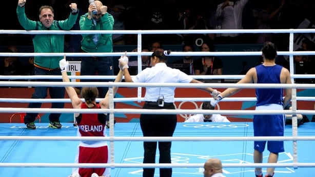 9 August 2012; Katie Taylor, Ireland, is declared the winner over Sofya Ochigava, Russia, in their women's light 60kg final contest, as Pete Taylor, her coach and father, and Team Ireland technical coach Zaur Antia celebrate the victory. London 2012 Olympic Games, Boxing, South Arena 2, ExCeL Arena,