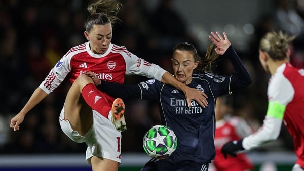 Arsenal's Katie McCabe tussles for possession with Real Madrid midfielder Caroline Weir
