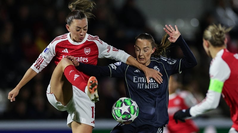 Arsenal's Katie McCabe (L) tussles for possession with Real Madrid midfielder Caroline Weir