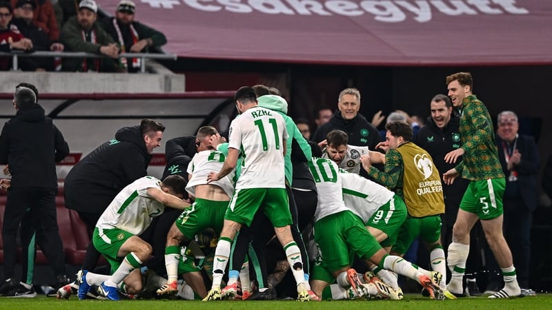 Irish players and staff celebrate Troy Parrott's winner against Hungary