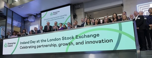 Image of a large group of business people on a platform at the London Stock Exchange