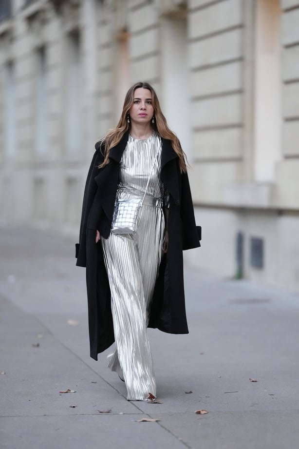 Maria Rosaria Rizzo wearing a silver pleated jumpsuit in Paris, France.