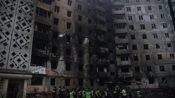 TERNOPIL, UKRAINE - NOVEMBER 19: Police officers stand near the damaged multi-story building after the Russian mass missile and drone attack on November 19, 2025 in Ternopil, Ukraine. During the night of November 19, the Russian army hit the city with dro