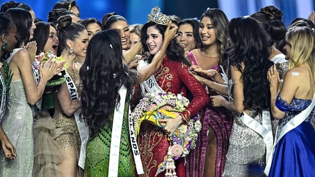 Miss Mexico Fatima Bosch is surrounded by contestants as she celebrates winning the 2025 Miss Universe pageant 