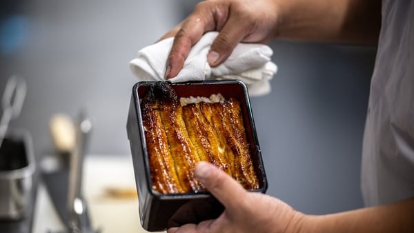 A chef cooking eels in a restaurant of Hiranuma eel farm