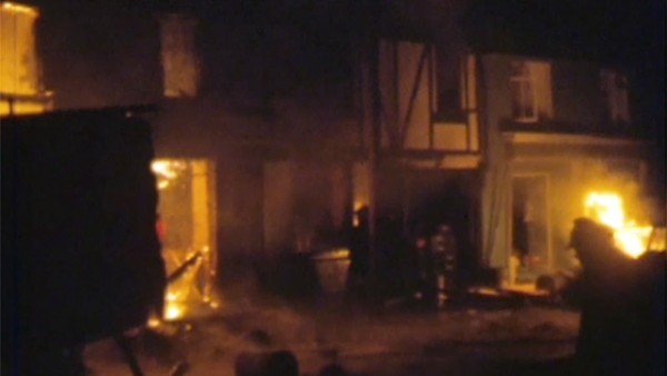 Fire fighters at Kay's Tavern in Dundalk following a bomb explosion, 1975.