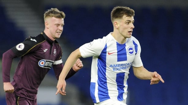 BRIGHTON, ENGLAND - APRIL 05: Jayson Molumby of Brighton and Hove Albion runs with the ball under pressure from Adam King of Swansea City during the Premier League 2 match between Brighton & Hove Albion U23 and Swansea City U23 at American Express Community Stadium on April 05, 2019 in Brighton, Eng