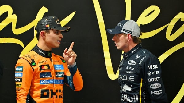 LAS VEGAS, NEVADA - NOVEMBER 21: Pole position qualifier Lando Norris of Great Britain and McLaren and Second placed qualifier Max Verstappen of the Netherlands and Oracle Red Bull Racing talk in parc ferme during qualifying ahead of the F1 Grand Prix of