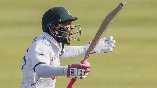 Bangladesh's Mushfiqur Rahim celebrates after scoring a century (100 runs) during the second day of the second Test cricket match between Bangladesh and Ireland at the Sher-e-Bangla National Cricket Stadium in Dhaka on November 20, 2025. Mushfiqur joined