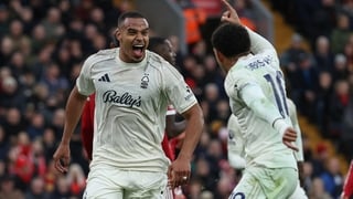 Nottingham Forest's Brazilian defender #05 Murillo (L) celebrates with teammate Nottingham Forest's English midfielder #10 Morgan Gibbs-White (R) after scoring the team's first goal during the English Premier League football match between Liverpool and No