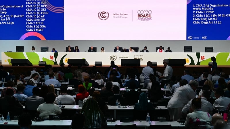 Attendees listen to COP30 President André Aranha Corrêa do Lago during a plenary session of the climate change conference