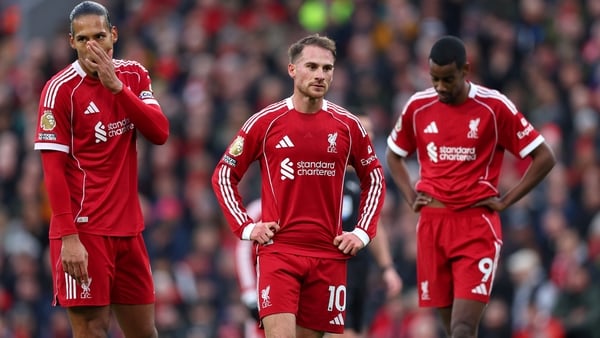 LIVERPOOL, ENGLAND - NOVEMBER 22: Virgil van Dijk, Alexis Mac Allister and Alexander Isak of Liverpool look dejected following the Premier League match between Liverpool and Nottingham Forest at Anfield on November 22, 2025 in Liverpool, England. (Photo b