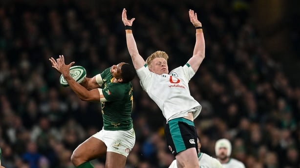 Tommy O'Brien of Ireland in action against Damian Willemse of South Africa during the Quilter Nations Series 2025 match between Ireland and South Africa at the Aviva Stadium in Dublin. 