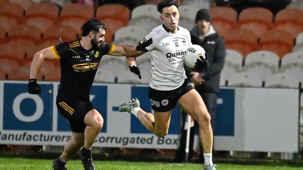 22 November 2025; Ryan Johnston of Kilcoo in action against YShane Mimna of Erne Gaels during the AIB Ulster GAA Football Senior Club Championship semi-final match between Erne Gaels Belleek and Kilcoo at BOX-IT Athletic Grounds in Armagh. Photo by Oliver McVeigh/Sportsfile