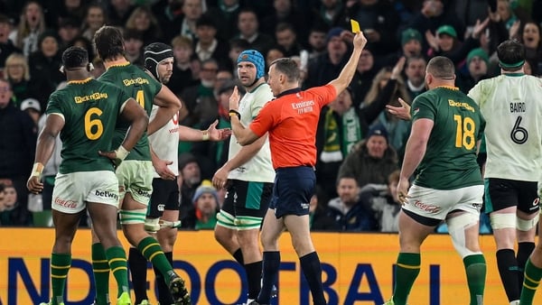 22 November 2025; Ireland captain Caelan Doris, left, remonstrates with referee Matthew Carley after he shows a yellow card to Andrew Porter of Ireland, hidden, during the Quilter Nations Series 2025 match between Ireland and South Africa at the Aviva Sta