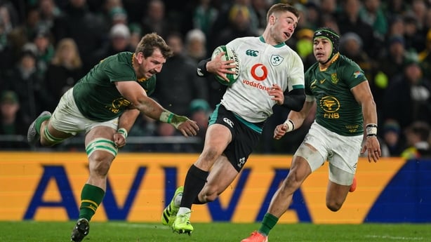 22 November 2025; Jack Crowley of Ireland breaks clear from Kwagga Smith, left, and Cheslin Kolbe of South Africa during the Quilter Nations Series 2025 match between Ireland and South Africa at the Aviva Stadium in Dublin. Photo by Brendan Moran/Sportsfile