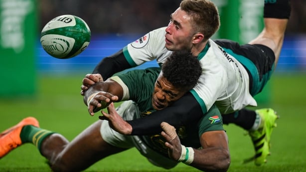 22 November 2025; Jack Crowley of Ireland tips the ball away from Canan Moodie of South Africa preventing a try during the Quilter Nations Series 2025 match between Ireland and South Africa at the Aviva Stadium in Dublin. Photo by Brendan Moran/Sportsfile