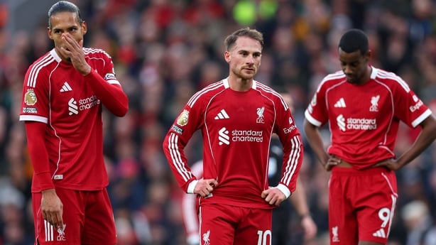 LIVERPOOL, ENGLAND - NOVEMBER 22: Virgil van Dijk, Alexis Mac Allister and Alexander Isak of Liverpool look dejected following the Premier League match between Liverpool and Nottingham Forest at Anfield on November 22, 2025 in Liverpool, England. (Photo by Molly Darlington/Getty Images)