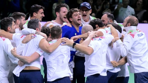 Italy's Flavio Cobolli (C) celebrates with teammates after winning over Spain's Jaume Munar Clar during their 2025 Davis Cup men's single final tennis match at the Super Tennis Arena in Bologna, northen Italy, on November 23, 2025. (Photo by Tiziana FABI