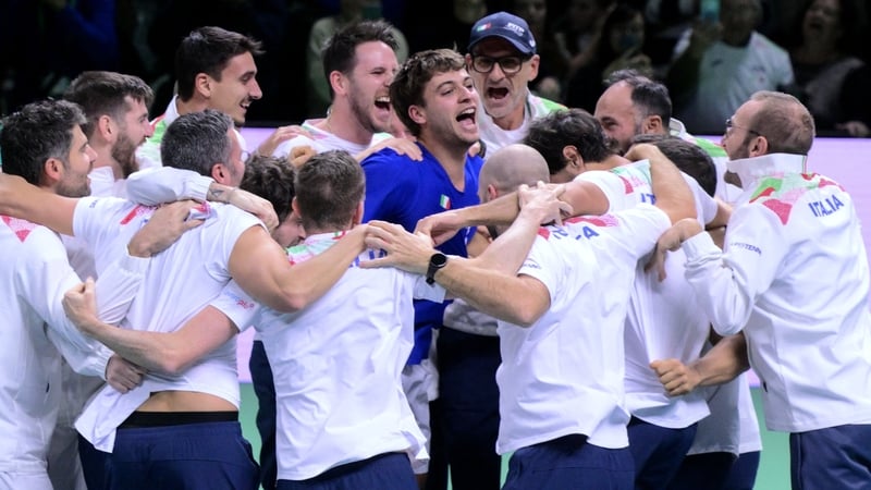 Italy's Flavio Cobolli (C) celebrates earning Davis Cup glory