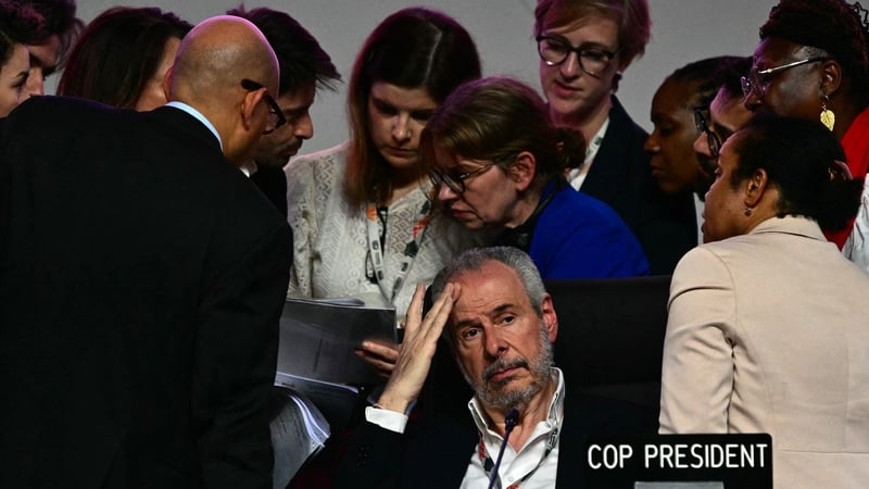 COP30 President André Corrêa do Lago (centre) gestures next to his advisers after the plenary session was interrupted