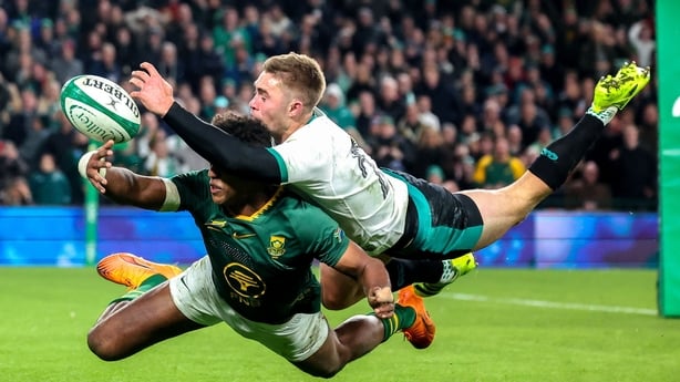 22 November 2025; Jack Crowley of Ireland tips the ball away from Canan Moodie of South Africa preventing a try during the Quilter Nations Series 2025 match between Ireland and South Africa at the Aviva Stadium in Dublin. Photo by John Dickson/Sportsfile