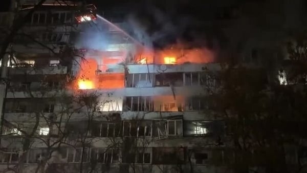 A building on fire in Kyiv after Russian strikes