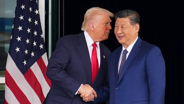US President Donald Trump and Chinese President Xi Jinping shake hands