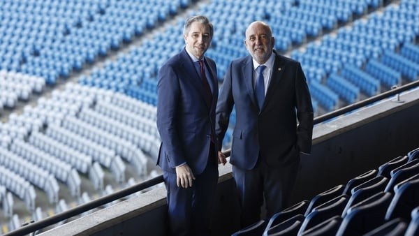 Image of Finance Minister Simon Harris and Central Bank Governor Gabriel Makhlouf in a stadium