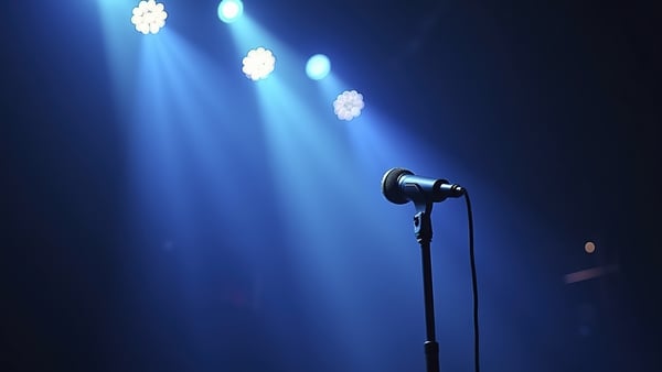 Colored spotlights and microphone on a stage
