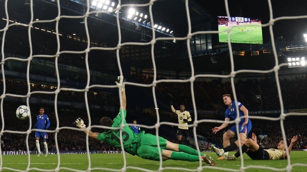 Liam Delap (R) scores their third goal during the UEFA Champions League league-phase football match between Chelsea and Barcelona at Stamford Bridge in London on November 25, 2025. 
