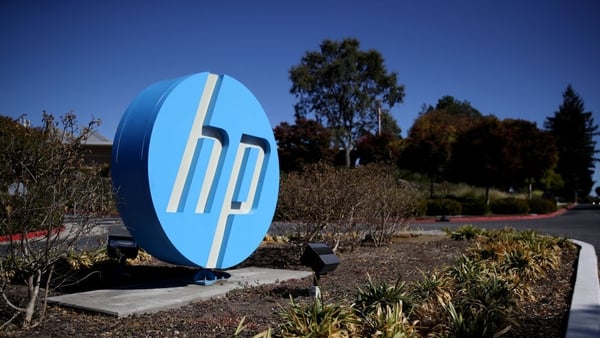 The Hewlett Packard (HP) logo is displayed in front of the office complex