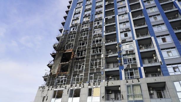 KYIV, UKRAINE - NOVEMBER 25: Local residents of Kyiv and emergency services are dealing with the aftermath of a combined night-time strike on a residential building on November 25, 2025 in Kyiv, Ukraine. A Russian missile and drone strike hit Kyiv overnight, causing civilian casualties. According to