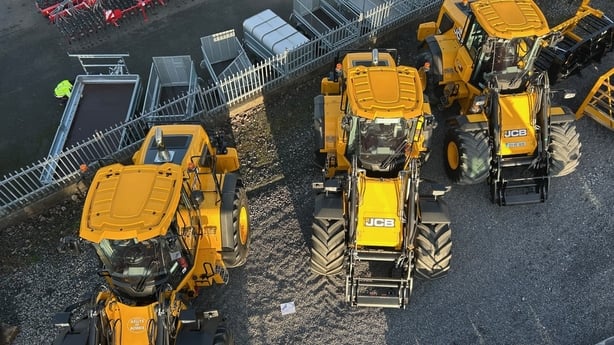 A line of JCB tractors