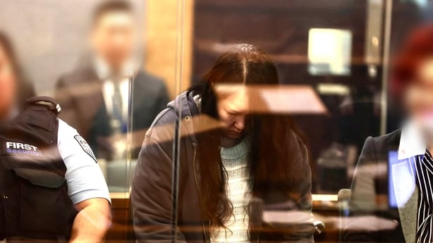 Hakyung Lee looks down during her sentencing to life imprisonment in a New Zealand court