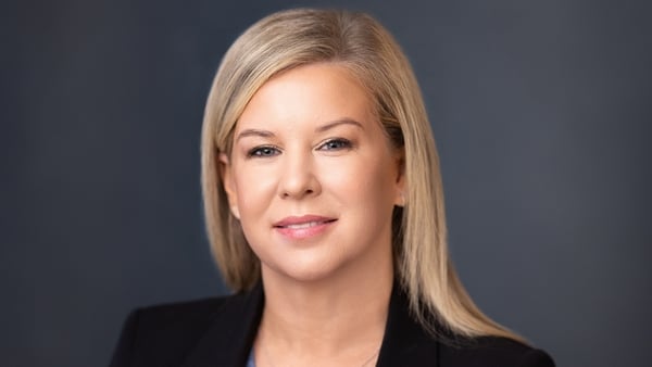 Image of a business woman against a dark background