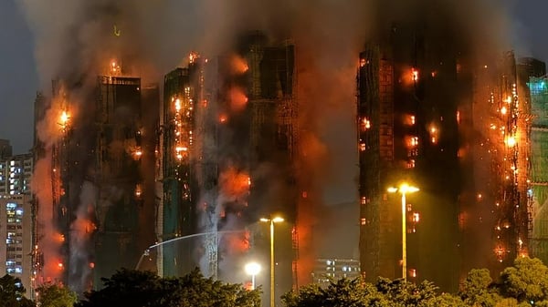 Thick smoke and flames rise as a major fire engulfs several apartment blocks in Hong Kong
