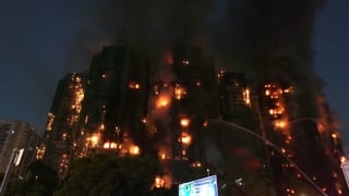 Four killed as fire engulfs Hong Kong high-rise