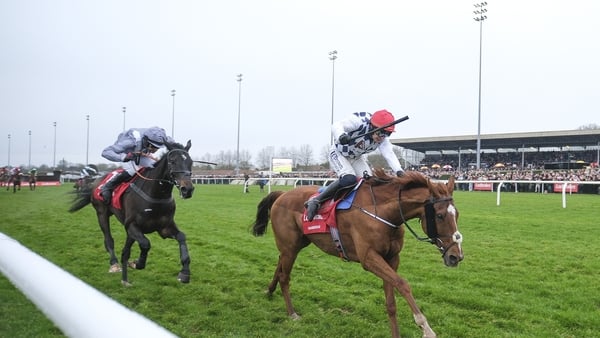Paul Townend ridiPaul Townend riding Banbridge (R, red cap) clear the last to win the King George VI Chase from James Reveley and Il Est Francais