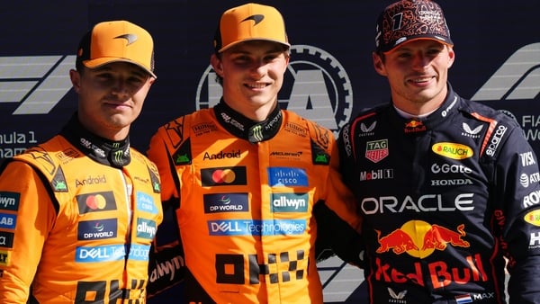 McLaren drivers Lando Norris (L) and Oscar Piastri (C) and Red Bull's Max Verstappen