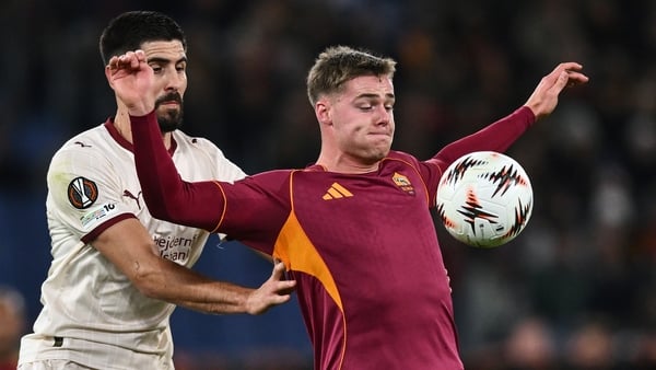 Evan Ferguson of Roma competes for the ball with Martin Erlic of Midtjylland during the UEFA Europa League 2025/26 League Phase MD5 match between AS Roma and FC Midtjylland at Stadio Olimpico on November 27, 2025 in Rome, Italy.