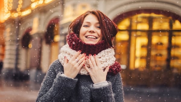 Woman wearing winter coat on the city street